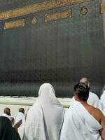 Mecca, Saudi Arabia, April 2023 - Pilgrims from all over the world are present in the courtyard of Masjid al-Haram for Tawaf. photo