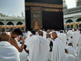 Mecca, Saudi Arabia, April 2023 - Pilgrims from all over the world are present in the courtyard of Masjid al-Haram for Tawaf. photo