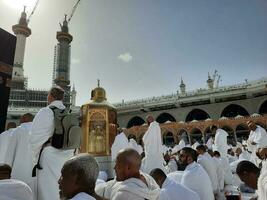 Mecca, Saudi Arabia, April 2023 - Pilgrims from all over the world are present in the courtyard of Masjid al-Haram for Tawaf. photo