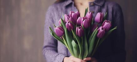 Violet tulip flowers bouquet on hands. Illustration photo