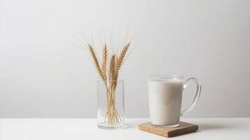 Mug and transparent vase with dry spikelets. Illustration photo