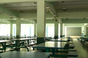dark empty school cafeteria , canteen under building photo