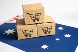 Box with shopping online cart logo and Australia flag, Import Export Shopping online or commerce finance delivery service store product shipping, trade, supplier concept. photo