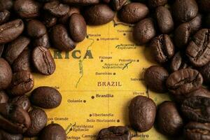 Bangkok, Thailand March 14, 2023 Coffee bean on Brazil map, import export trade online commerce concept. photo