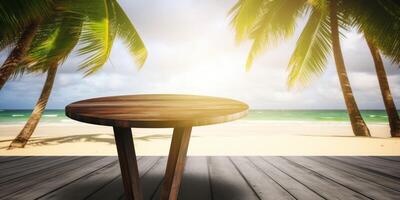 A wooden table on a beach with a palm tree photo