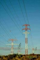 Electricity poles on the hill photo