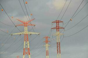 A field with electricity poles photo