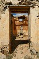 Abandoned house in the desert photo