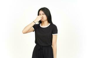 Smelling something stinky and disgusting of Beautiful Asian Woman Isolated On White Background photo