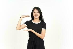 Measuring and Showing Big Sign Product Of Beautiful Asian Woman Isolated On White Background photo