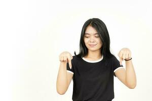 Smiling and Pointing Down showing blank copy space Of Beautiful Asian Woman Isolated On White photo