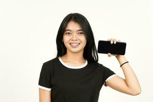Showing blank smartphone screen Of Beautiful Asian Woman Isolated On White Background photo