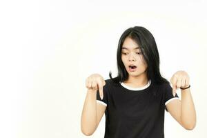 Shocked Face And Pointing Down showing blank copy space Of Beautiful Asian Woman Isolated On White photo