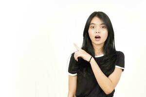 Shocked face Showing Product and Pointing Side using forefinger Of Beautiful Asian Woman photo