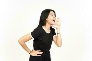 Making Announcement with hands over mouth Of Beautiful Asian Woman Isolated On White Background photo