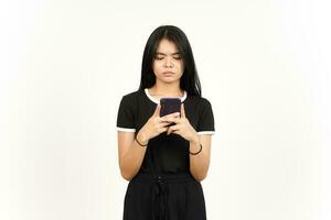 Holding or Using Smartphone with sad or angry face Of Beautiful Asian Woman Isolated On White photo