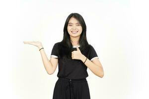 Showing and Presenting Product on Open Palm with Thumbs up Of Beautiful Asian Woman Isolated photo