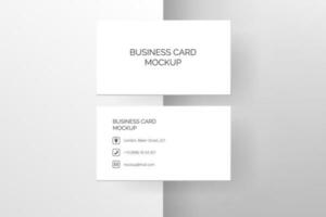 Elegant vector mock up featuring a white business card with 3D shadow and graphic background in minimalistic style. Use it to create a fresh and creative corporate identity or stationery.