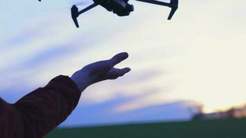 Aerial Drone Lands on the Palm of a Hand video