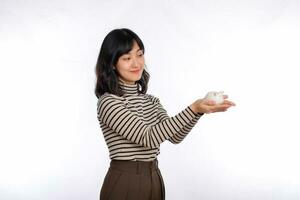 Portrait of young Asian woman casual uniform holding white piggy bank isolated on white background, Financial and bank saving money concept photo