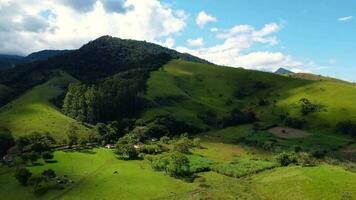 Beautiful mountain, green trees and blue sky drone aerial footage video