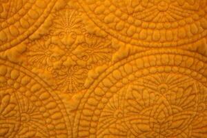 Saffron Colored Quilted Fabric photo