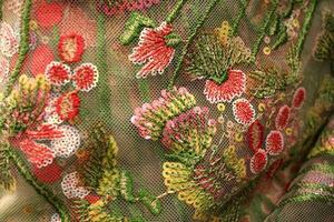 Ornate Floral Embroidery on Tulle Fabric photo