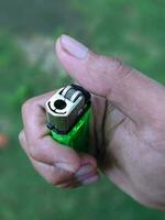 hand holding a match and about to light it photo