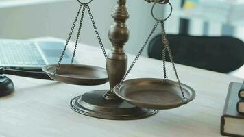 Justice and law concept.Male judge in a courtroom with the gavel, working with, computer and docking keyboard, eyeglasses, on table in morning light video