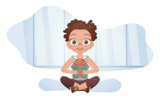 A cute little girl sits in a lotus position with a gift in her hands. Vector illustration.