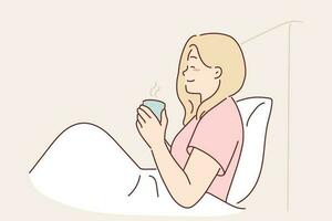 Woman is drinking coffee sitting in bed under blanket enjoying morning weekend and good mood. Girl with mug of coffee has breakfast in bedroom, drinks invigorating drink to wake up faster and smiles vector