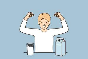 Teenage boy drinks cows milk and flaunts muscles showing off strength gained from eating lactose. Child stands near table with package of milk useful for child organism and immunity vector