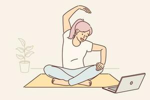 Woman sits on yoga mat and looks at laptop screen doing exercises during online broadcast for subscribers. Girl fitness trainer conducts internet yoga training and demonstrating stretching exercises vector