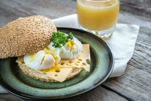 Sandwich with poached eggs photo