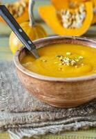 Bowl of pumpkin soup photo