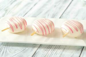 Cakes in the shape of popsicles photo