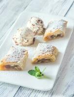 Slices of apple strudel on the white plate photo