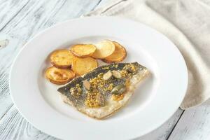 Baked sea bass with capers photo