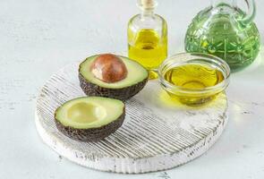 Fresh avocado with avocado oil photo