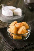 Brie fritters in glass bowl photo