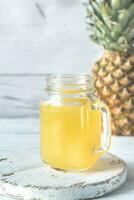 Glass of pineapple juice photo
