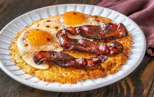 Hash brown with egg and bacon photo