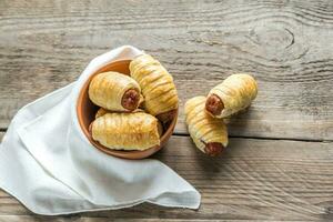 Bowl with sausage rolls photo