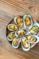 Baked half shell mussels photo