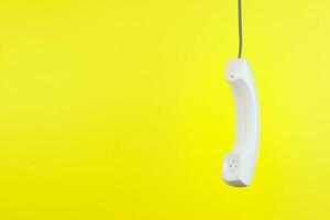 White telephone receiver with copy space photo