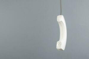 White telephone receiver with copy space photo