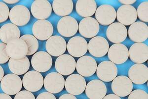 White round pill for healthcare. Medical treatment photo