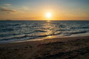 Panorama front viewpoint landscape travel summer sea wind wave cool on holiday calm coastal big sun set sky light orange golden Nature tropical Beautiful evening hour day At Bang san Beach Thailand. photo