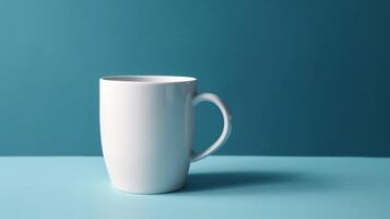 Empty White coffee cup isolated on blue background, photo