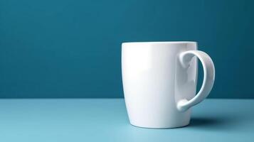 Empty White coffee cup isolated on blue background, photo